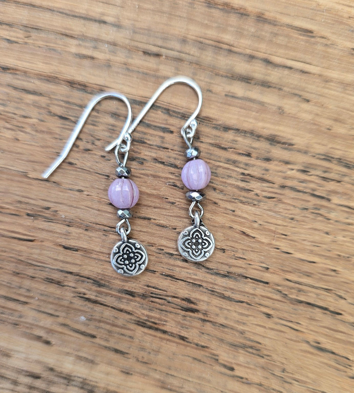 Lilac Czech glass and hematite dangly earrings with flower pendants